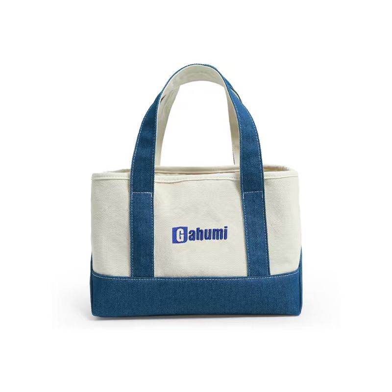 Cream tote bag with blue handles and base and a printed Gahumi logo